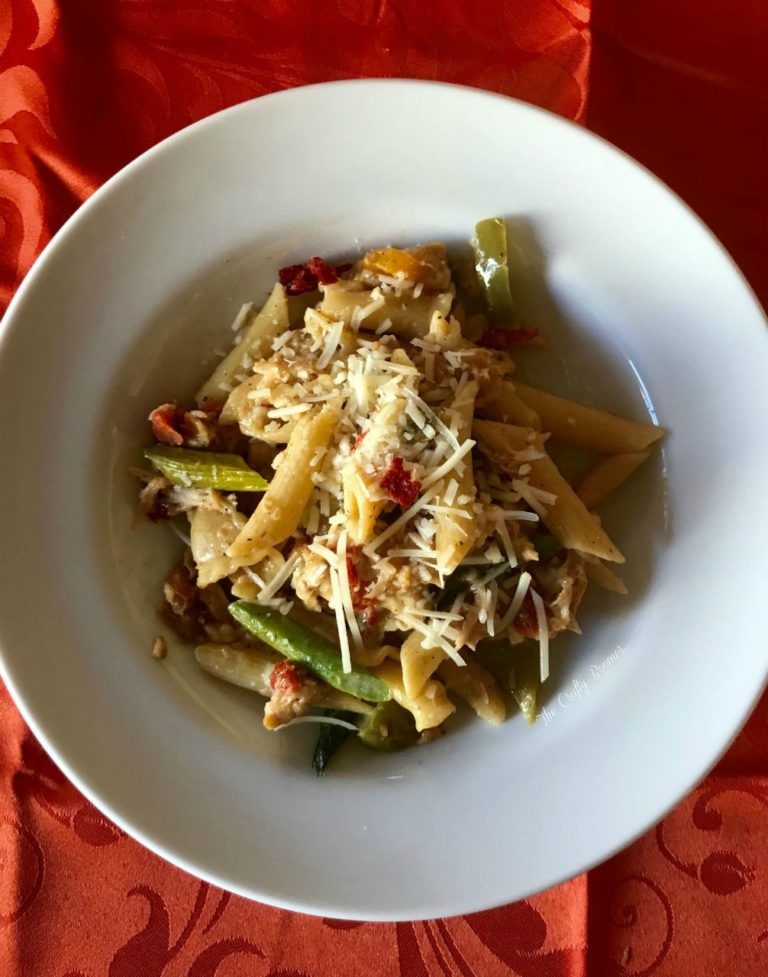 A pasta made with a cream cheese base with vegetables to booth.