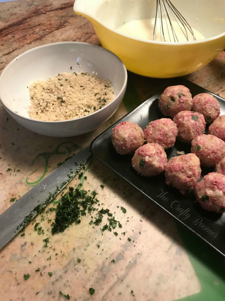 Crispy Reuben Balls are a party's delight. They're filled with savory sauerkraut, chopped corn beef, dipped in an egg batter fried up until they are crispy golden brown. Served with a tangy mustard sauce.