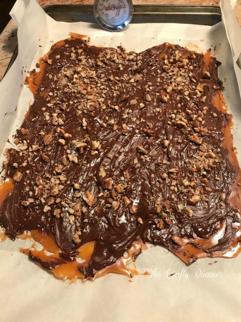 A hard but chewy caramel colored candy, with chocolate and nuts added.