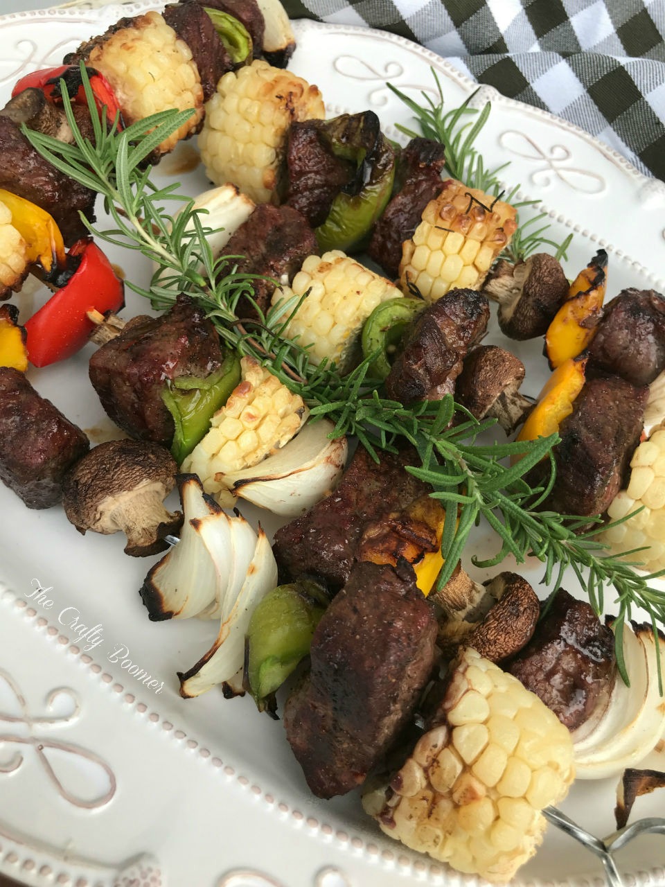 Grilled smoky steak and vegetable kebabs are the center of a perfect meal. A marinade adds flavor to these grilled to perfection kebabs.