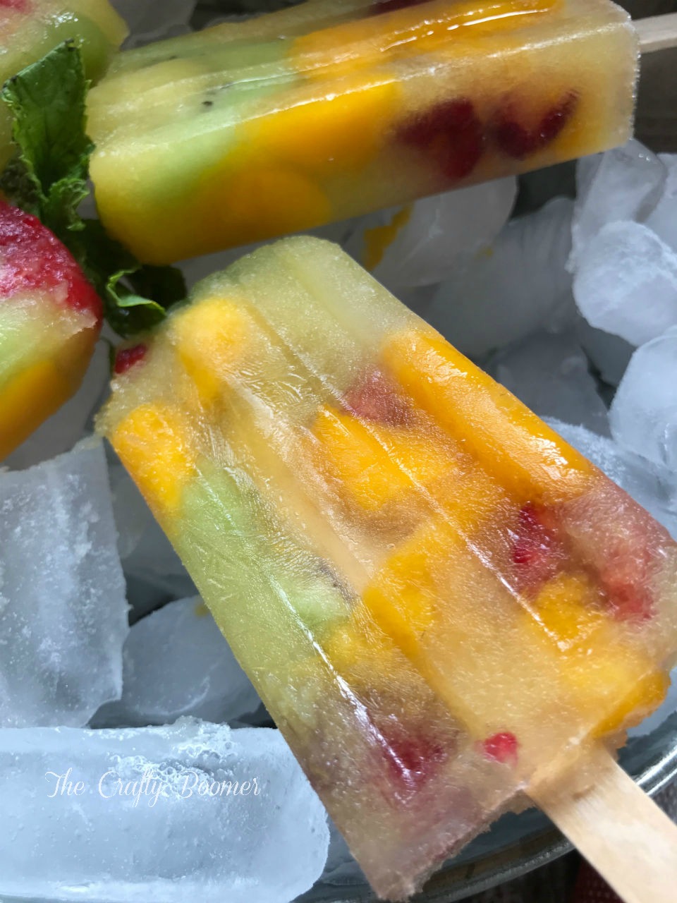 There is know better way to beat the heat than with tropical kiwi mango raspberry popsicles are delicious and nutritious.