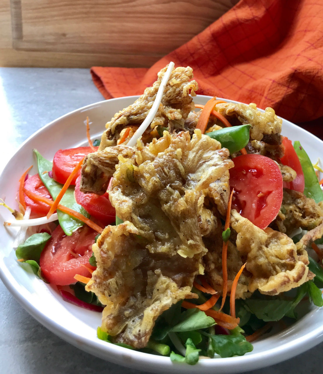 Tempura Crispy Oyster Mushroom Salad is a delicate blend of crispy and meaty flavor.