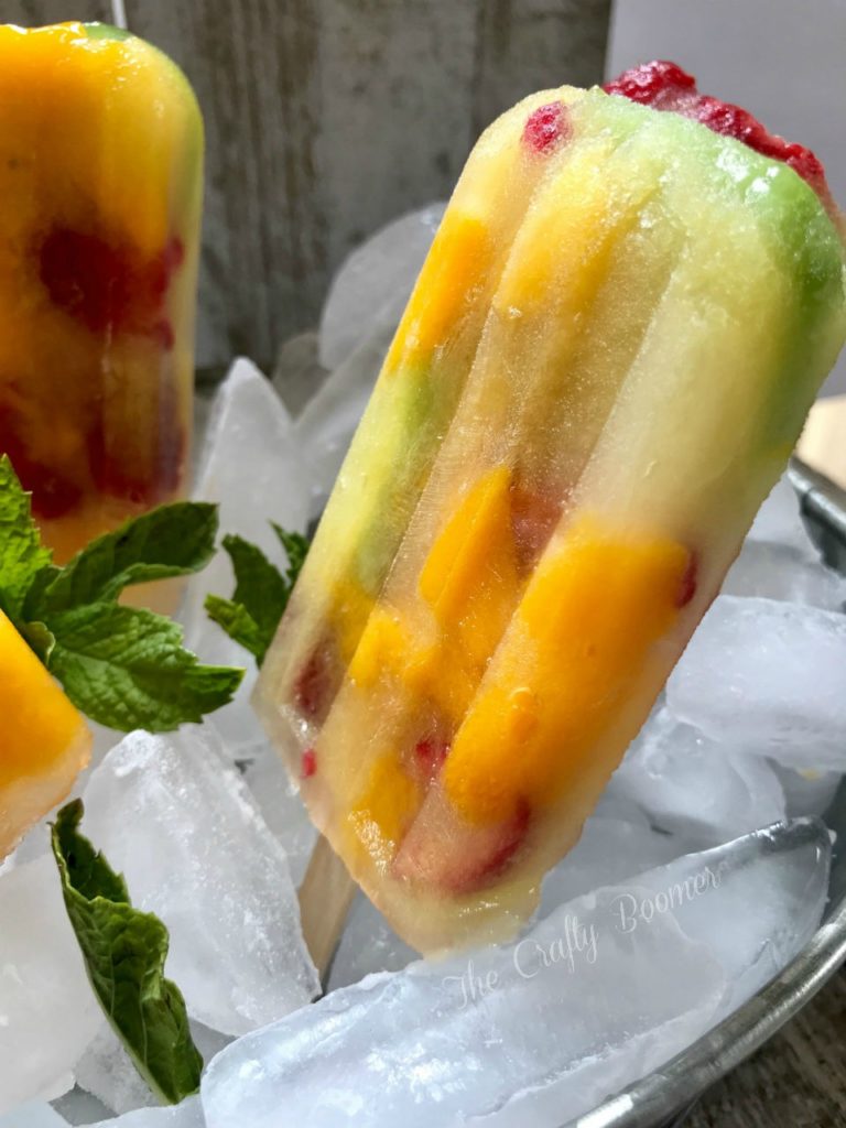 There is know better way to beat the heat than with tropical kiwi mango raspberry popsicles are delicious and nutritious.