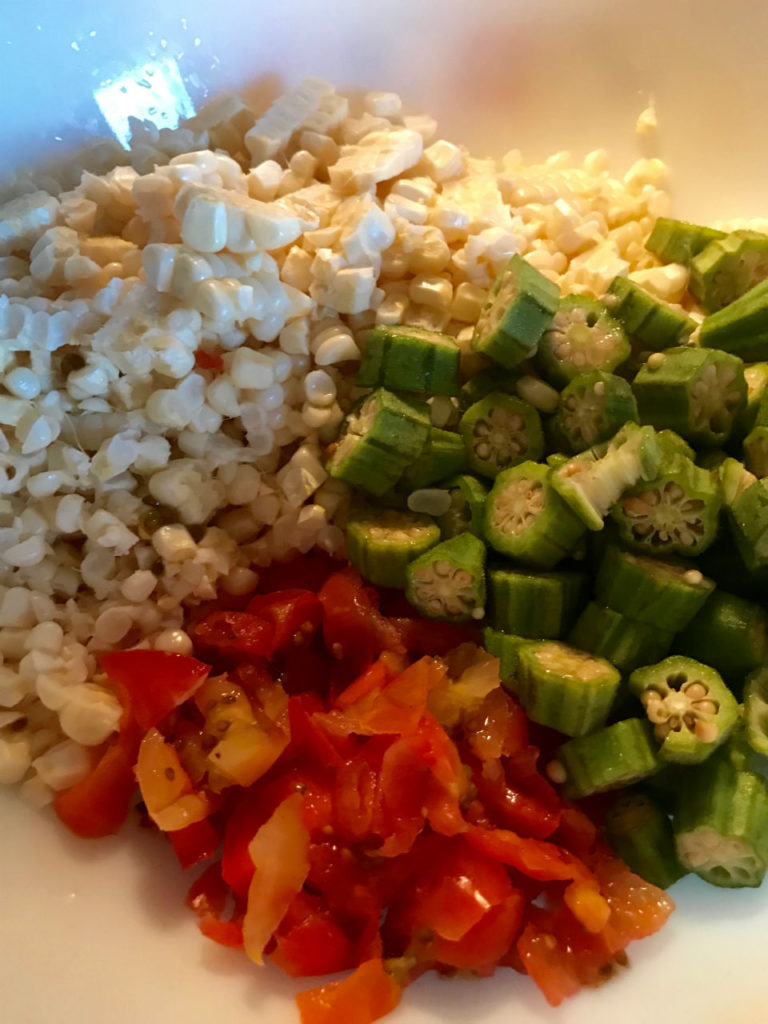 Fresh corn paired with tomatoes and okra to make a beautiful blend.