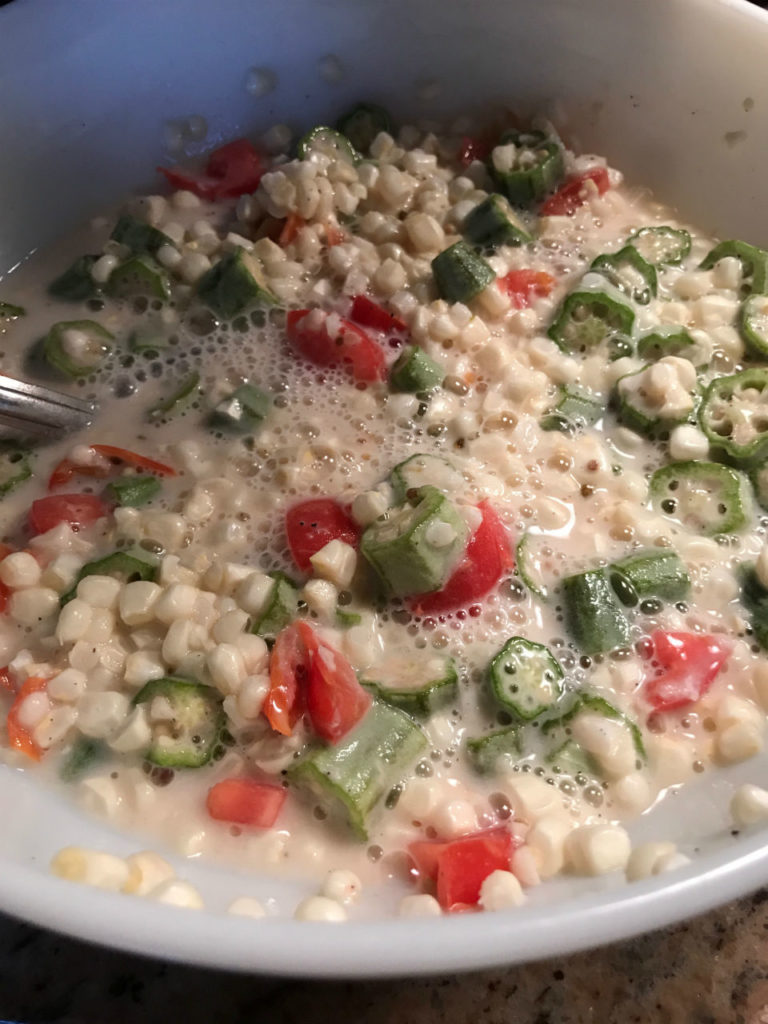 Creamy fried corn with okra and tomatoes is a sure delight to the palate.