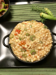 Creamy fried corn with okra and tomatoes is a sure delight to the palate.