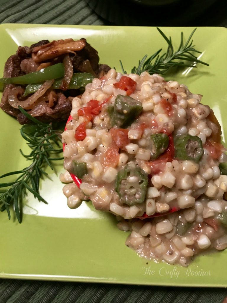 Creamy fried corn with okra and tomatoes is a sure delight to the palate.