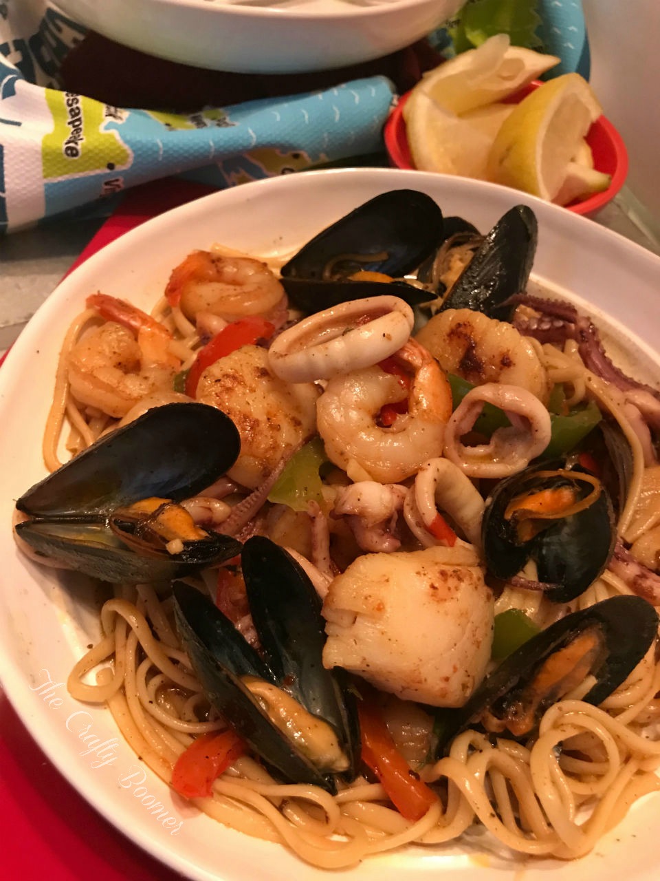 Coastal Seafood Linguine is a savory pasta dish laced with squids, shrimp, scallops, and mussels make for a comforting meal. French bread for dunking in the sauce is all you need to serve on the side.