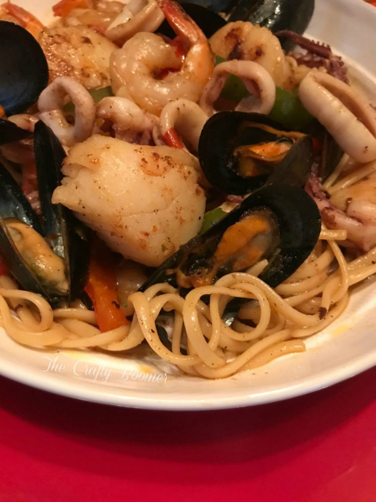 Costal Seafood Linguine is a savory pasta dish laced with squids, shrimp, scallops and mussels makes for a comforting meal. French bread for dunking in the sauce are all you need to serve on the side.