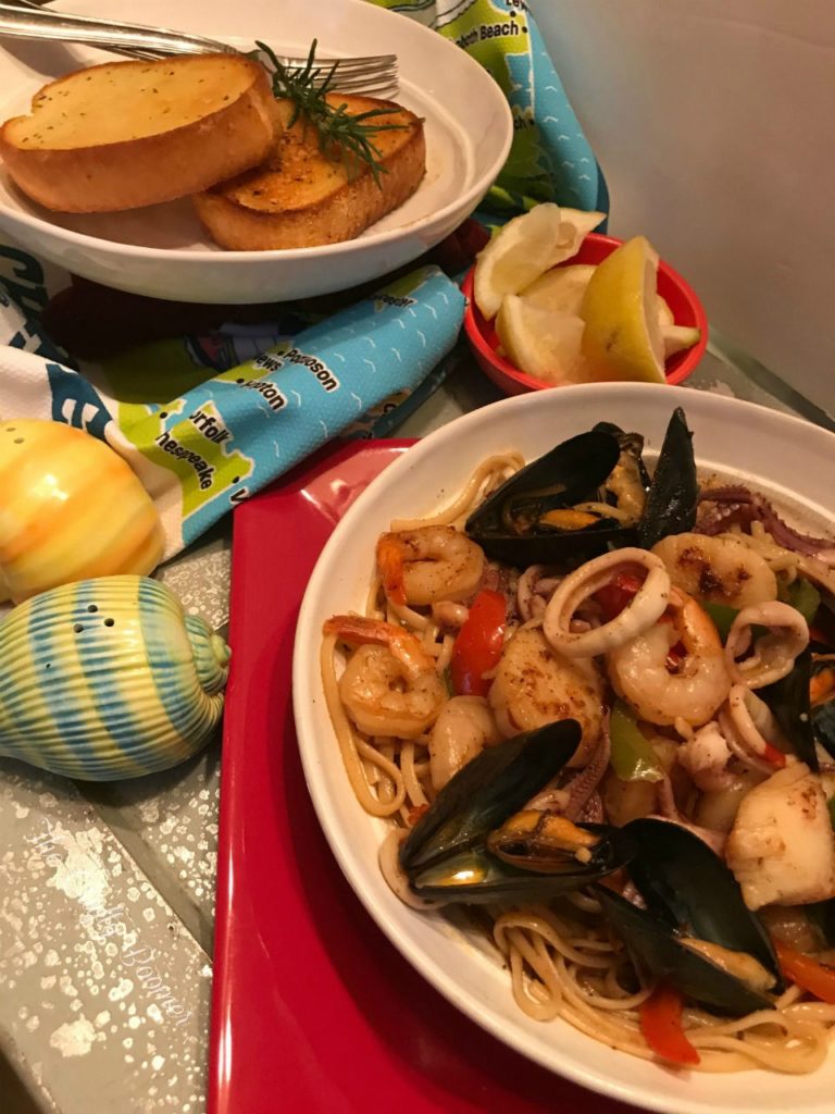 Costal Seafood Linguine is a savory pasta dish laced with squids, shrimp, scallops and mussels makes for a comforting meal. French bread for dunking in the sauce are all you need to serve on the side.