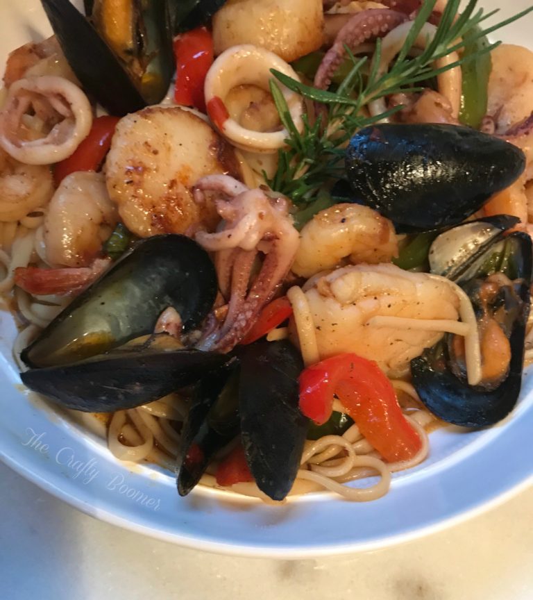 Costal Seafood Linguine is a savory pasta dish laced with squids, shrimp, scallops and mussels makes for a comforting meal. French bread for dunking in the sauce are all you need to serve on the side.